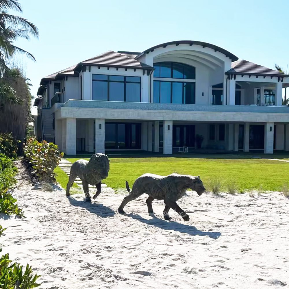 large Bronze Sculptures of a Lion Couple Heading Toward the Sea