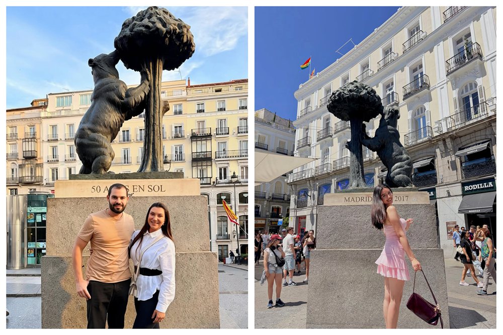 Happy tourists taking photos with the famous Bear and Strawberry Tree monument