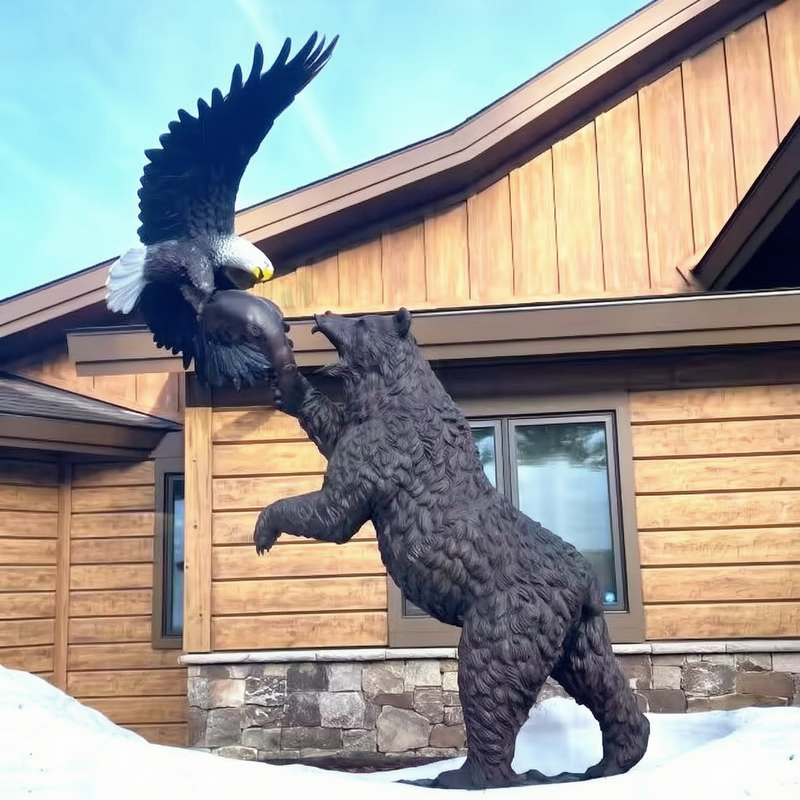 outdoor bronze bear and eagle statue