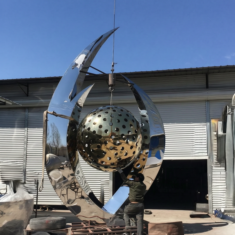 finished abstract sculpture with ball