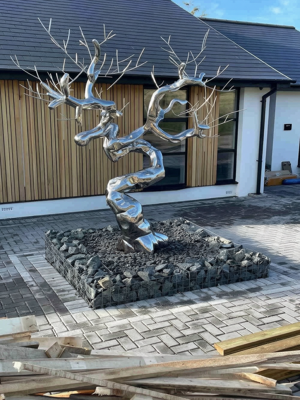Stainless steel tree sculpture feedback- in a private garden