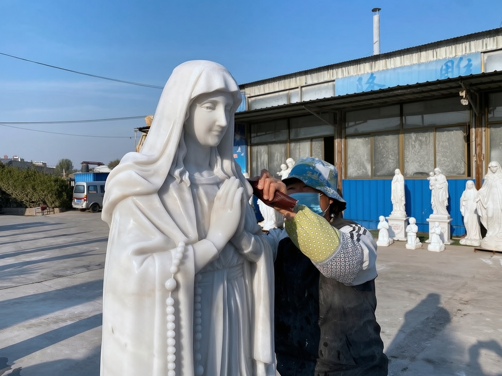 The final polishing stage of the statue of the Virgin Mary